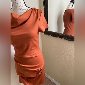 Beautiful rust orange dress with snatched waist that flatters your curves.